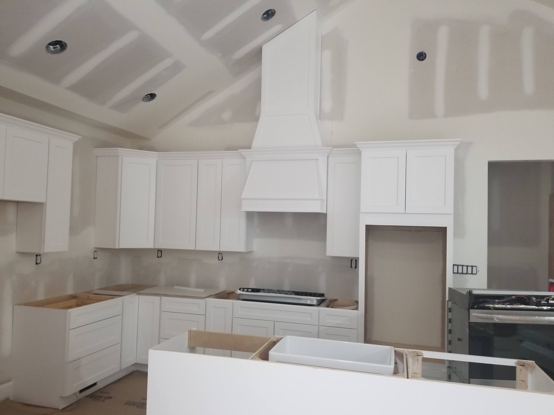 Finished kitchen with vaulted ceiling in a completed Tessco build